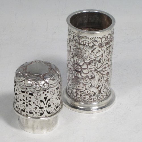 Antique Victorian sterling silver pepper pot (or small sugar caster), having a cylindrical body with hand-chased floral decoration, a hand-pierced pull-off lid, and sitting on a collet foot. Made by Nathan & Hayes of Chester in 1895. The dimensions of this fine hand-made silver caster / pepper pot are height 10 cms (4 inches), diameter at base main body 4 cms (1.5 inches), and it weighs approx. 85g (2.7 troy ounces)    