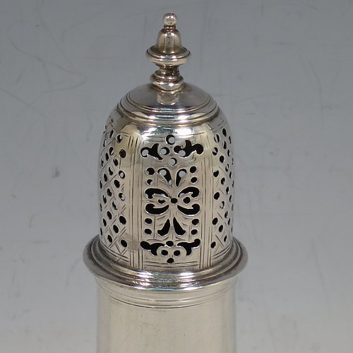 An Antique Georgian George II Sterling Silver pepper pot, having a plain baluster body with applied reeded borders, a hand-pierced pull-off lid with urn-shaped finial, and sitting on a pedestal foot. Made by Samuel Woods of London in 1758. The dimensions of this fine hand-made antique silver pepper pot are height 15 cms (6 inches), diameter of main body 5 cms (2 inches), and it weighs approx. 131g (4.2 troy ounces).   