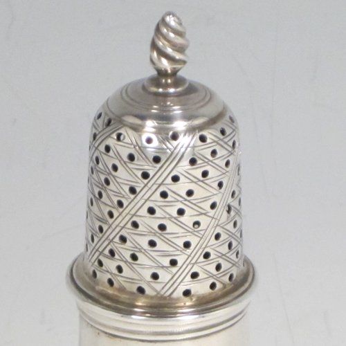 Antique Georgian sterling silver pepper pot, having a plain baluster body with an applied gadroon border, a hand-pierced pull-off lid with swirl finial, and sitting on a pedestal foot. Made by John Delmester of London in 1765. The dimensions of this fine hand-made silver pepper pot are height 11.5 cms (4.5 inches), diameter of main body 4.5 cms (1.75 inches), and it weighs approx. 72g (2.3 troy ounces).   