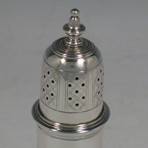 Antique Victorian sterling silver pepper pot, having a plain baluster body, a hand-pierced pull-off lid with urn finial, and sitting on a pedestal foot. Made by Robert Hennell II of London in 1882. The dimensions of this fine hand-made silver pepper pot are height 14 cms (5.5 inches), diameter of main body 5 cms (2 inches), and it weighs approx. 118g (3.8 troy ounces)   