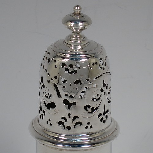 A very handsome Antique Georgian George I Sterling Silver heavy pepper pot caster, having a plain bellied body with applied and hand-chased reeded borders, a pull-off hand-pierced lid with cast finial, all sitting on a stepped pedestal foot. Made by Samuel Welder of London in 1725. The dimensions of this fine hand-made antique silver pepper caster pot are height 16 cms (6.25 inches), width 6.5 cms (2.5 inches), and it weighs approx. 185g (6 troy ounces).    