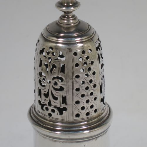 A very handsome Antique Georgian George II Sterling Silver pepper pot, having a plain baluster body with applied reeded borders, a hand-pierced pull-off lid with urn-shaped finial, and sitting on a pedestal foot. Made by Samuel Woods of London in 1749. The dimensions of this fine hand-made antique silver pepper pot are height 16 cms (6.25 inches), diameter of main body 6 cms (2.3 inches), and it weighs approx. 158g (5 troy ounces).    