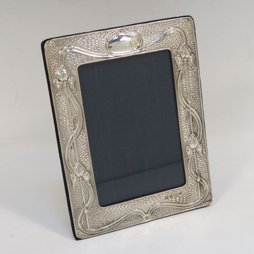 A very pretty Antique Edwardian Sterling Silver Art Nouveau style photograph frame, having a hand-chased body lilies and a basket-weave back-ground, and a dark green velvet-backed easel frame. This beautiful antique silver photo frame was made by A. and J. Zimmerman of Birmingham in 1902. The internal dimensions of this fine hand-made antique art nouveau silver photo frame are height 13.5 cms (5.25 inches), and width 9 cms (3.5 inches).   