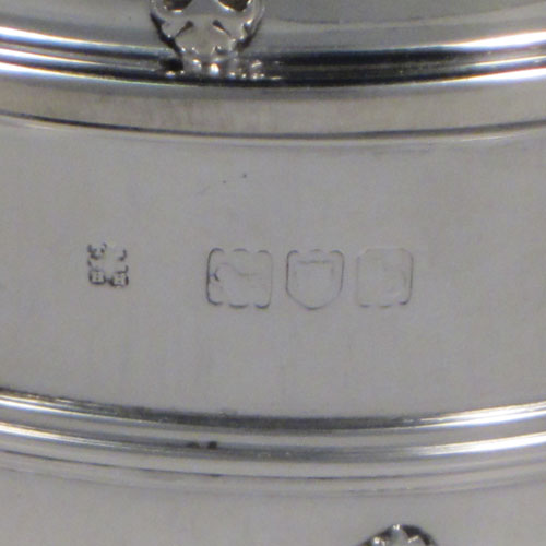 Antique Victorian sterling silver porringer and lid, having a round baluster body, a round lift-off lid, two oxe-eye side handles, all decorated with applied strap-work motifs, and sittng on a collet foot. Made by Holland, Aldwinckle, and Slater of London 1897. The dimensions of this fine hand-made silver porringer and lid are height 9 cms (3.5 inches), spread across arms 16. cms (6.5 inches), and it weighs approx. 324g (10.5 troy ounces).