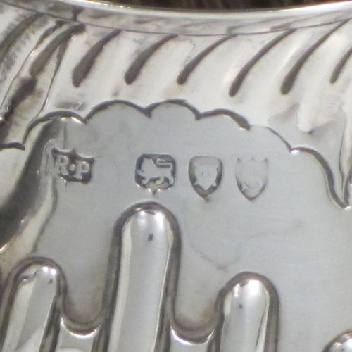 Antique Victorian sterling silver porringer, having a round baluster body with hand-chased half swirl-fluted decoration, two scroll side handles, and sitting on a flat base. Made by Robert Pringle of London in 1893. The dimensions of this fine hand-made silver porringer are height 8 cms (3 inches), spread across arms 12 cms (4.75 inches), and it weighs approx. 115g (3.7 troy ounces).   