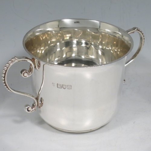 An Antique Victorian Sterling Silver porringer, having a plain round baluster body, two scroll side handles with beaded decoration, and sitting on a flat base. Made by Francis Higgins of London in 1897. The dimensions of this fine hand-made antique silver porringer are height 7.5 cms (3 inches), spread across arms 14 cms (5.5 inches), and it weighs approx. 163g (5.3 troy ounces).   