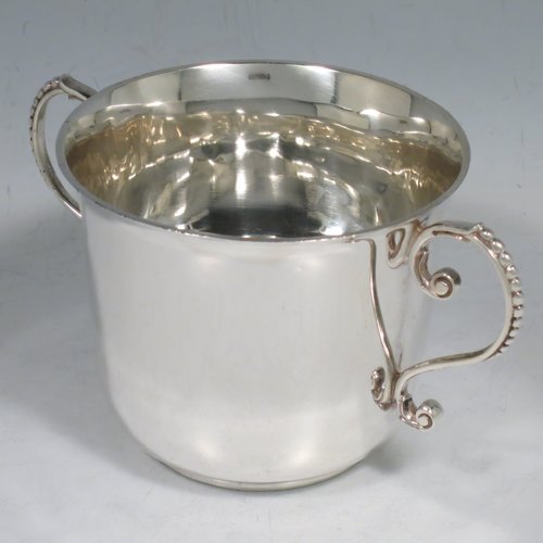 An Antique Victorian Sterling Silver porringer, having a plain round baluster body, two scroll side handles with beaded decoration, and sitting on a flat base. Made by Francis Higgins of London in 1897. The dimensions of this fine hand-made antique silver porringer are height 7.5 cms (3 inches), spread across arms 14 cms (5.5 inches), and it weighs approx. 163g (5.3 troy ounces).   