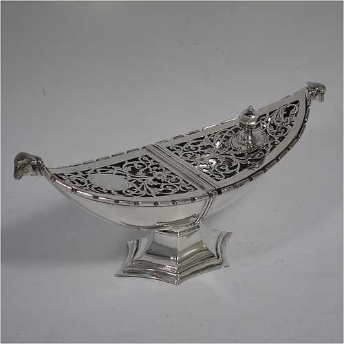 A very pretty Antique Sterling Silver pot pourri holder, or ecclesiastical Thurible incense burner, having an unusual boat-shaped body with a hand-pierced floral style cover, with one side hinged with a cast octagonal ball finial, two cast lambs-head side-handles, and all sitting on a spreading hexafoil pedestal foot. Made by Nathan and Hayes of Chester in 1912. The dimensions of this fine hand-made antique silver pot-pourri holder, or ecclesiastical Thurible incense burner, are length 19 cms (7.5 inches), width 6.5 cms (2.5 inches), height 8 cms (3 inches), and it weighs approx. 195g (6.3 troy ounces) 