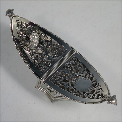 A very pretty Antique Sterling Silver pot pourri holder, or ecclesiastical Thurible incense burner, having an unusual boat-shaped body with a hand-pierced floral style cover, with one side hinged with a cast octagonal ball finial, two cast lambs-head side-handles, and all sitting on a spreading hexafoil pedestal foot. Made by Nathan and Hayes of Chester in 1912. The dimensions of this fine hand-made antique silver pot-pourri holder, or ecclesiastical Thurible incense burner, are length 19 cms (7.5 inches), width 6.5 cms (2.5 inches), height 8 cms (3 inches), and it weighs approx. 195g (6.3 troy ounces) 