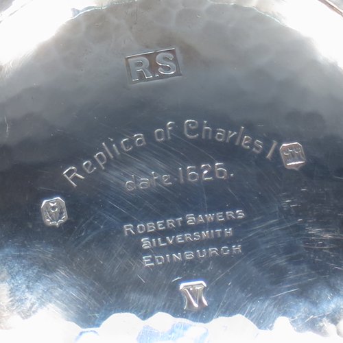 A Sterling Silver large Scottish quaich (being a  replica of a Charles I example dated 1626), having a very plain round body with hand-hammered finish, with two side handles, and sitting on a collet foot. Made by Robert Sawers  of Edinburgh in 1926. The dimensions of this fine hand-made silver quaich are diameter of body 15 cms (6 inches), height 5 cms (2 inches), and it weighs approx. 310g (10 troy ounces).