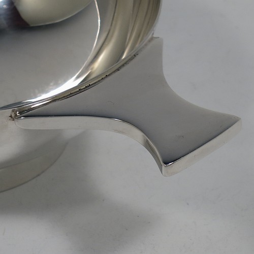 A very handsome and large Sterling Silver Scottish quaich, having a very plain round body, with two side handles, and sitting on a collet foot. Made by Mappin and Webb of Edinburgh in 1997. The dimensions of this fine hand-made silver quaich are diameter of body 13 cms (5 inches), height 5 cms (2 inches), and it weighs approx. 318g (10 troy ounces).    