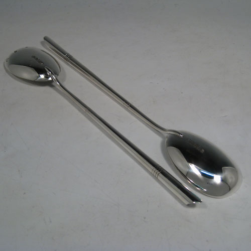    Antique Victorian sterling silver pair of Arts and Crafts salad servers, having very plain bodies, with oval bowls, tapering handles with bands of reeded engraving. Made by Henry Wilkinson of Sheffield in 1898. The length of these silver salad servers are 28 cms (11 inches), and the total weight is approx. 126g (4.1 troy ounces). 