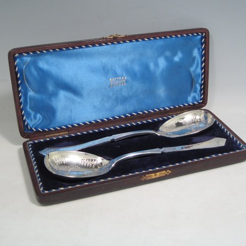 Antique Victorian silver-plated pair of salad servers, having oval bowls and geometrically shaped handled, and featuring hand-engraved floral decoration, all in their original blue satin and velvet-lined presentation box. Made by Francis Higgins in ca. 1880. The length of these fine hand-made silver salad servers are 24 cms (9.5 inches).   