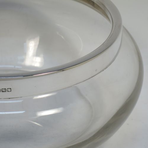 A handsome Antique Sterling Silver and hand-cut crystal salad bowl, having a plain round body with a plain applied silver rim, and all sitting on a flat base. Made by Henry Atkins of Sheffield in 1914. The dimensions of this fine hand-made antique silver and crystal salad bowl are diameter 23 cms (9 inches), and height 10 cms (4 inches).   