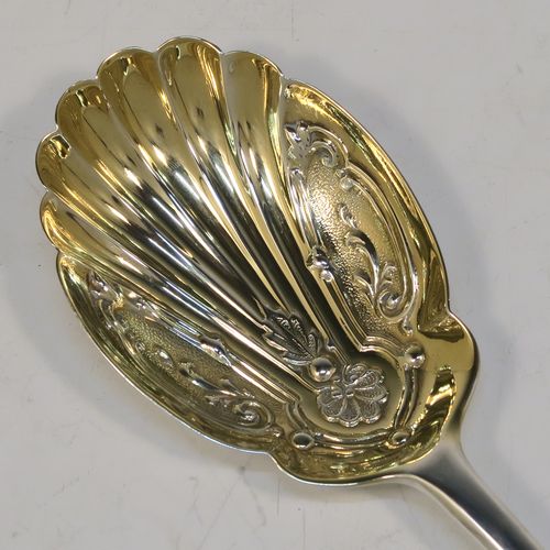 A very pretty pair of Antique Edwardian Sterling Silver salad servers, having plain Old English pattern handles, with hand-chased scalloped and gold-gilt bowls. This beautiful antique silver pair of salad serving spoons was made by Marple and Co., of Sheffield in 1902. The dimensions of these hand-made silver salad servers are length 21.5 cms (8.5 inches), and they weigh a total of 125g (4 troy ounces.   