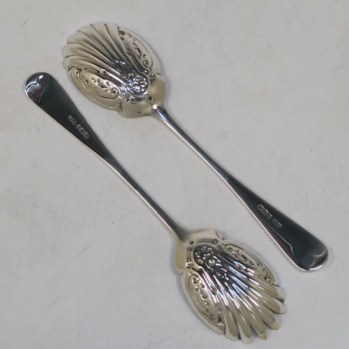 A very pretty pair of Antique Edwardian Sterling Silver salad servers, having plain Old English pattern handles, with hand-chased scalloped and gold-gilt bowls. This beautiful antique silver pair of salad serving spoons was made by Marple and Co., of Sheffield in 1902. The dimensions of these hand-made silver salad servers are length 21.5 cms (8.5 inches), and they weigh a total of 125g (4 troy ounces.   