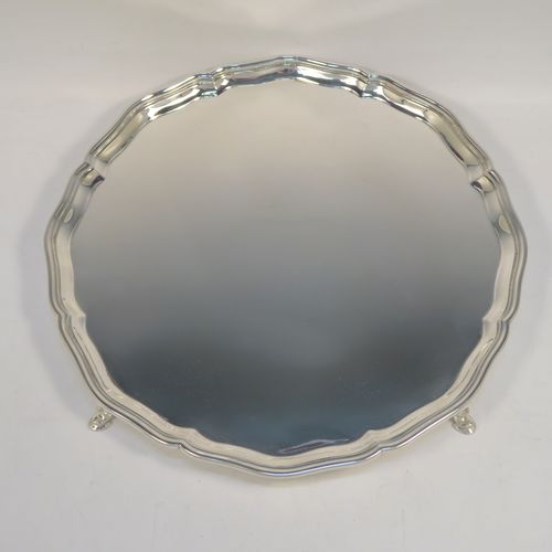 A very handsome Sterling Silver salver, having an applied shaped and reeded Bath border, a plain ground, and sitting on four cast hoof feet. This elegant and large silver salver was made by Charles Boytons and Sons of Sheffield in 1932. The dimensions of this fine hand-made silver salver are diameter 36 cms (14 inches), and it weighs approx. 1,270g (41 troy ounces).   