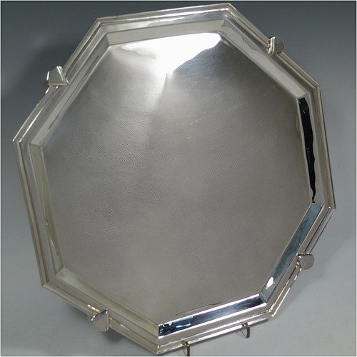 A very handsome and striking Art Deco Sterling Silver salver, having an octagonal body with an applied reeded border, with a plain burnished ground, and sitting on four cast panelled feet. Made by Charles William Fletcher of Sheffield in 1936. The dimensions of this fine hand-made Art Deco style silver salver are 34 cms (13.5 inches) diameter, and it weighs approx. 992g (32 troy ounces).    