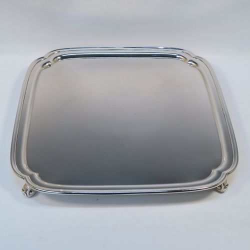 A very elegant Sterling Silver salver, having a square body with shaped and cut corners, a plain burnished ground, an applied reeded border, and sitting on four cast scroll feet. This handsome silver salver was made by S. Blankensee and Sons Ltd., of Birmingham in 1937. The dimensions of this fine hand-made silver salver are 34.5 cms (13.5 inches) square, and it weighs approx. 1,210g (39 troy ounces).  