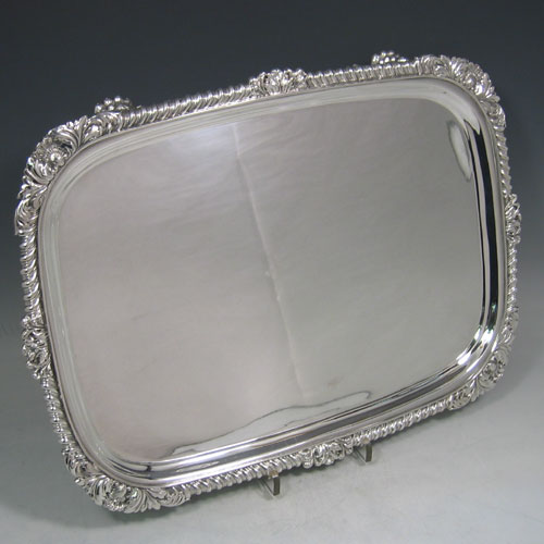    Antique Georgian sterling silver rectangular salver with gadroon & shell border made in London in 1825. Length 42 cms, width 31 cms.