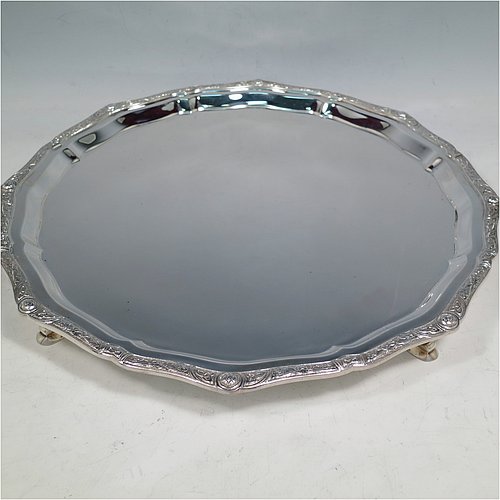 A Sterling Silver salver, having an applied shaped cast Celtic or Cymric border, a plain ground, and sitting on four cast hoof feet. Made by Roberts & Belk of Sheffield in 1988. The dimensions of this fine hand-made silver salver are diameter 32 cms (12.5 inches), and it weighs approx. 900g (29 troy ounces).    