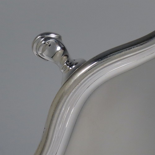 A Sterling Silver salver, having a square body with shaped and cut corners, a plain burnished ground, an applied reeded border, and sitting on four cast hoof feet. Made by Hawksworth Eyre and Co., of London in 1925. The dimensions of this fine hand-made silver salver are 26 cms (10.25 inches) square, and it weighs approx. 809g (26 troy ounces).    