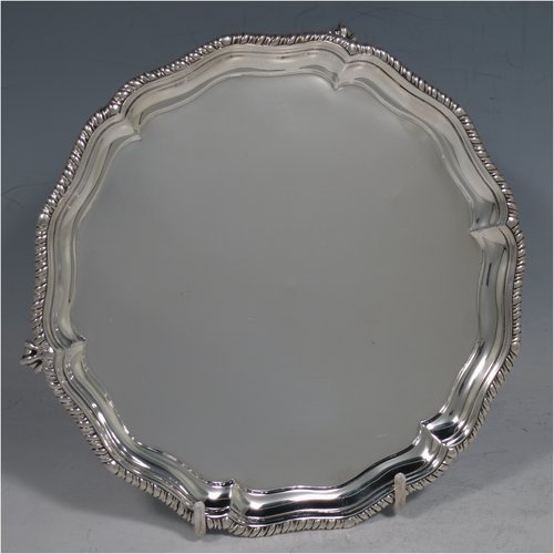 An Antique Victorian Sterling Silver salver, having a shaped gadroon border, a plain ground, and sitting on three claw and ball feet. Made by Charles Stuart Harris of London in 1888. The dimensions of this fine hand-made antique silver salver are diameter 18 cms (7 inches), and it weighs approx. 248g (8 troy ounces).    