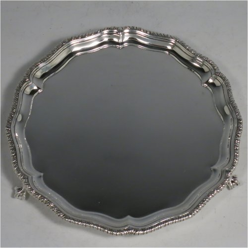 An Antique Victorian Sterling Silver salver, having a shaped gadroon border, a plain ground, and sitting on three claw and ball feet. Made by Charles Stuart Harris of London in 1888. The dimensions of this fine hand-made antique silver salver are diameter 18 cms (7 inches), and it weighs approx. 248g (8 troy ounces).    