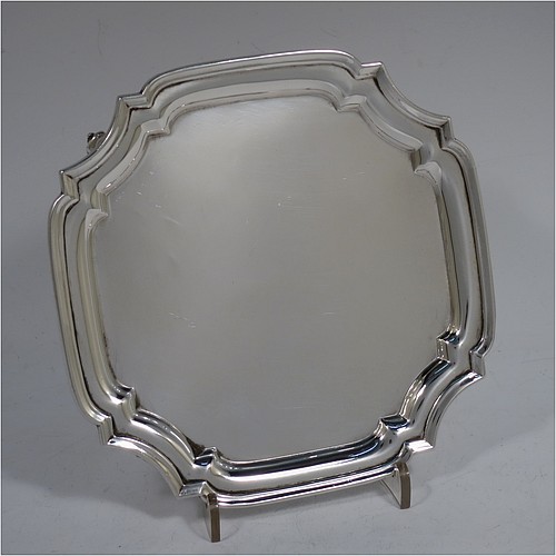 A very handsome Sterling Silver salver, having a square body with an applied cut-corner border, a plain ground, and sitting on four cast scroll feet. Made by S. Blanckensee and Sons of Chester in 1930. The dimensions of this fine hand-made silver salver are 15 cms (6 inches) square, and it weighs approx. 254g (8.2 troy ounces).    