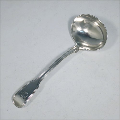 An Antique Georgian Sterling Silver pair of Sauce Ladles in the double-struck Fiddle & Thread pattern. Made by George Piercy of London in 1821. The dimensions of this fine pair of hand-made antique silver sauce ladles are length 17 cms (6.75 inches), and they weigh a total of approx. 140g (4.5 troy ounces). Please note that these items are crested.   