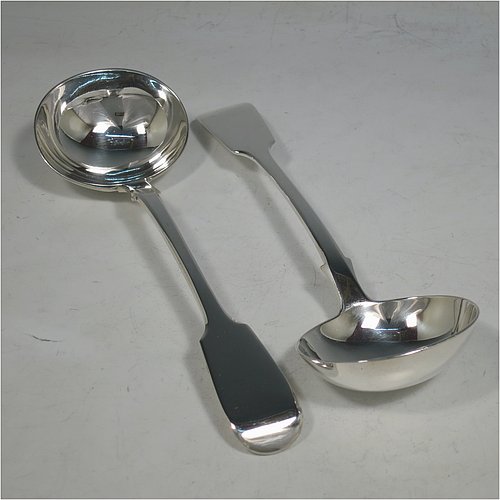 An Antique Victorian Sterling Silver pair of Sauce Ladles in the plain Fiddle pattern with pip on reverse. Made by Charles Lias of London in 1847. The dimensions of this fine pair of hand-made antique silver sauce ladles are length 18.5 cms (7.25 inches), and they weigh a total of approx. 140g (4.5 troy ounces).   