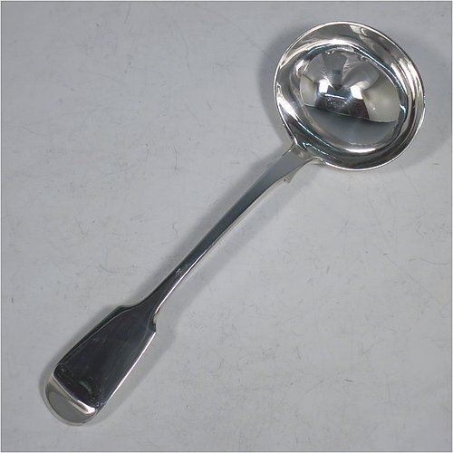 An Antique Victorian Sterling Silver pair of Sauce Ladles in the plain Fiddle pattern with pip on reverse. Made by Charles Lias of London in 1847. The dimensions of this fine pair of hand-made antique silver sauce ladles are length 18.5 cms (7.25 inches), and they weigh a total of approx. 140g (4.5 troy ounces).   