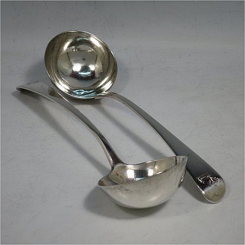 An Antique Georgian Sterling Silver pair of Sauce Ladles in the Old English pattern. Made by George Smith & William Fearn of London in 1790. The dimensions of this fine pair of hand-made antique silver sauce ladles are length 18 cms (7 inches), and they weigh a total of approx. 104g (3.4 troy ounces). Please note that these items are crested.    