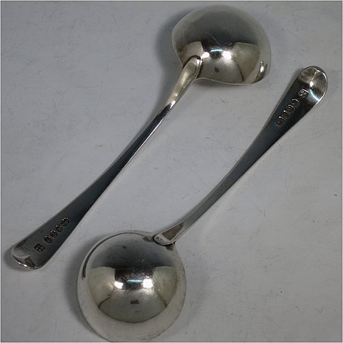 An Antique Georgian Sterling Silver pair of Sauce Ladles in the Old English pattern. Made by George Smith & William Fearn of London in 1790. The dimensions of this fine pair of hand-made antique silver sauce ladles are length 18 cms (7 inches), and they weigh a total of approx. 104g (3.4 troy ounces). Please note that these items are crested.    