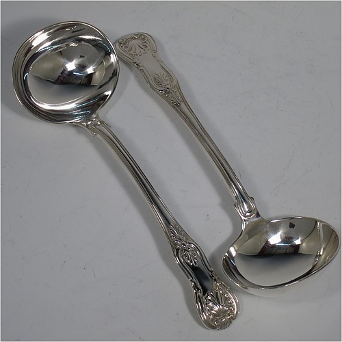 An Antique Georgian Sterling Silver pair of Sauce Ladles in the double-struck Kings pattern. Made by Charles Eley of London in 1825. The dimensions of this fine pair of hand-made Kings Pattern antique silver sauce ladles are length 17 cms (6.75 inches), and they weigh a total of approx. 147g (4.7 troy ounces).   