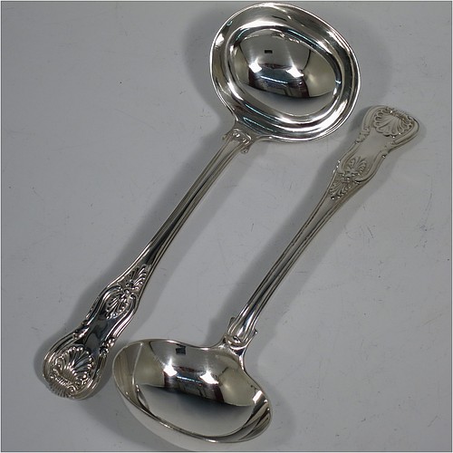 An Antique Georgian Sterling Silver pair of Sauce Ladles in the double-struck Kings pattern. Made by Charles Eley of London in 1825. The dimensions of this fine pair of hand-made Kings Pattern antique silver sauce ladles are length 17 cms (6.75 inches), and they weigh a total of approx. 147g (4.7 troy ounces).   