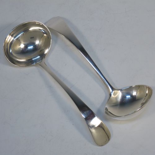 A handsome Sterling Silver pair of sauce ladles in the plain Old English pattern, and having oval bowls. Made by Robert Pringle of London in 1925. The dimensions of this fine pair of hand-made silver sauce ladles are length 17 cms (6.75 inches), and they weigh a total of approx. 136g (4.4 troy ounces).   