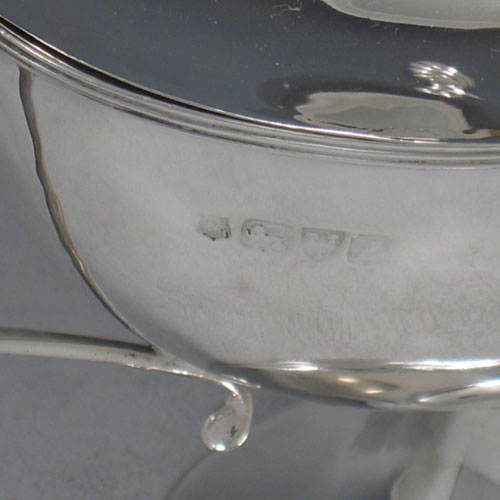 Antique Victorian sterling silver sauce tureen and cover, having a plain oval body, reeded borders, two scroll handles, a pull-off lid with flame finial, and all sitting on a pedestal foot. Made by Nathan and Hayes of Chester in 1901. Height 16 cms (6.25 inches), length 23 cms (9 inches), width 9 cms (3.5 inches). Weight approx. 360g (11.6 troy ounces).