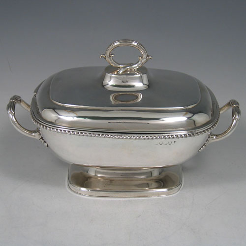    Antique Georgian sterling silver sauce tureen and cover, made by Robert Garrard I of London in 1807. Length 21 cms, height 14 cms.