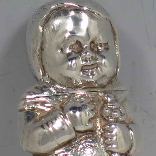 An Antique Victorian Sterling silver novelty scent bottle, in the shape of a baby in swaddling, and holding a babies rattle, with a hinged head and internal glass stopper. Made by Samson & Mordan of London in 1882. The dimensions of this fine hand-made antique silver scent bottle are length 7.5 cms (3 inches), width 2.5 cms (1 inch), and it weighs approx. 33g (1 troy ounce).