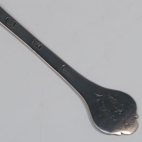 A very handsome Antique James II Sterling Silver Trefid-end table spoon, having a lace-backed rattail pattern bowl, which is slightly worn down on one side (consistent with right-hand usage), together with a trefid terminal having engraved contemporaneous sets of initials on both sides. In original condition with fine patina and colour this elegant James II silver spoon was hallmarked for London in 1688. The dimensions of this fine hand-made antique silver seventeenth century table spoon are length 20cms (8 inches), and it weighs  approx. 55g (1.8 troy ounces).

   