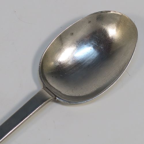 A very handsome Antique James II Sterling Silver Trefid-end table spoon, having a lace-backed rattail pattern bowl, which is slightly worn down on one side (consistent with right-hand usage), together with a trefid terminal having engraved contemporaneous sets of initials on both sides. In original condition with fine patina and colour this elegant James II silver spoon was hallmarked for London in 1688. The dimensions of this fine hand-made antique silver seventeenth century table spoon are length 20cms (8 inches), and it weighs  approx. 55g (1.8 troy ounces).

   