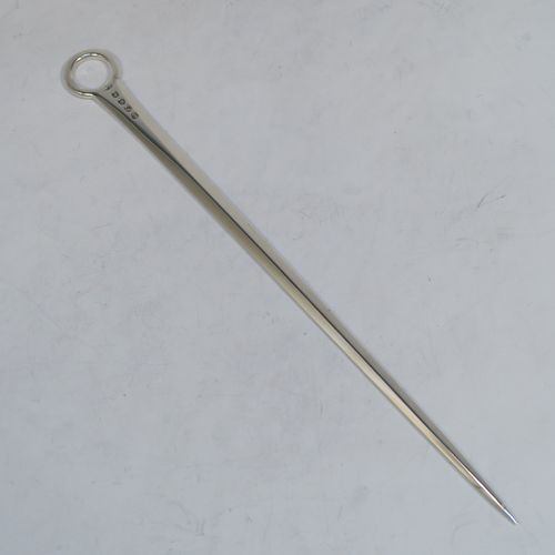 A large and very handsome Antique Georgian George II Sterling Silver meat or game bird skewer, having a very plain tapering body with a plain ring handle. This elegant antique silver skewer was made by Stephen Adams II of London in 1805. The dimensions of this fine hand-made antique silver game bird or meat skewer are length 30.5 cms (12 inches), and it weighs approx. 75g (2.4 troy ounces).  