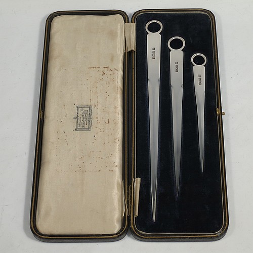 A very handsome set of three Antique Sterling Silver  meat and game bird skewers, having very plain tapering bodies with ring handles, in three sizes and in their original cream satin and black velvet-lined presentation box. This elegant set of silver skewers were made by Martin Hall and Co. Ltd., of Sheffield  in 1923. The dimensions of this fine hand-made set of Antique silver game bird or meat skewers are length of longest skewer 25.5 cms (10 inches), and they weigh a total of approx. 127g (4 troy ounces)   