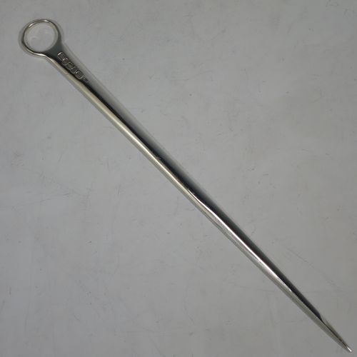 A handsome Antique Georgian Sterling Silver meat or game bird skewer, having a very plain tapering body with a ring handle. Made by Smith and Fern of London in 1787. The dimensions of this fine hand-made antique silver game bird or meat skewer are length 28 cms (11 inches), and it weighs approx. 70g (2.3 troy ounces).    