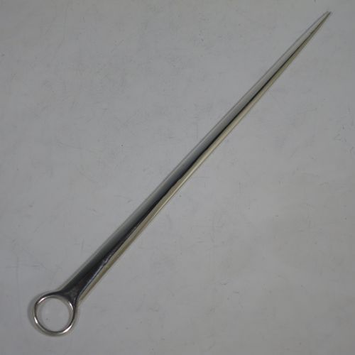 A handsome Antique Georgian Sterling Silver meat or game bird skewer, having a very plain tapering body with a ring handle. Made by Smith and Fern of London in 1787. The dimensions of this fine hand-made antique silver game bird or meat skewer are length 28 cms (11 inches), and it weighs approx. 70g (2.3 troy ounces).    