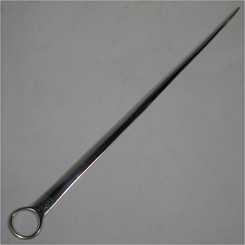 A very handsome Antique Georgian Sterling Silver meat or game bird skewer, having a very plain tapering body with a plain ring handle. Made in London in 1776. The dimensions of this fine hand-made antique silver game bird or meat skewer are length 27 cms (10.5 inches), and it weighs approx. 46g (1.5 troy ounces). Please note that this item is crested.   