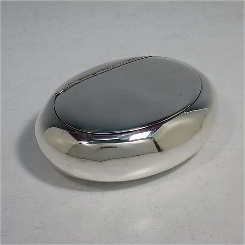 An Antique Victorian Sterling Silver tobacco box, having a plain oval body, and squeeze-action sprung hinged lid. Made by Elkington & Co., of Birmingham in 1901. The dimensions of this fine hand-made antique silver tobacco box are length 9 cms (3.5 inches), width 6.5 cms (2.5 inches), depth 3 cms (1.25 inches), and it weighs approx. 102g (3.3 troy ounces).    