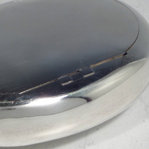 An Antique Victorian Sterling silver tobacco box, having a plain oval body, and squeeze-action sprung hinged lid. Made by Saunders & Shepherd of Birmingham in 1896. The dimensions of this fine hand-made silver tobacco box are length 8.5 cms (3.3 inches), depth 2.5 cms (1.0 inches), and it weighs approx. 75g (2.4 troy ounces).   