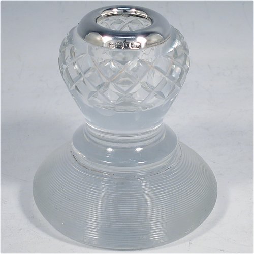 An Antique Victorian Sterling Silver and crystal match holder and striker, having a a very unusual round baluster body, with a silver rim around the match holder, a hand-cut hobnail pattern upper body and a lower ridged body for striking the matches. Made by James Round of Sheffield in 1895. The dimensions of this fine hand-made antique silver and crystal match striker are diameter 8.5 cms (3.3 inches), and height 9.5 cms (3.75 inches).   